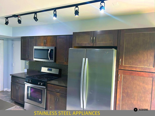 1212 Thyne Ct Unit 29C, Wheeling, IL 60090 - kitchen with appliances with stainless steel finishes, dark countertops, tasteful backsplash, and rail lighting