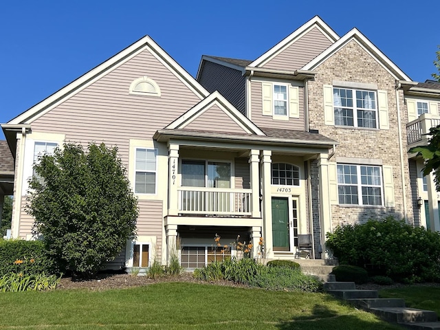 14703 Paul Revere Ct, Plainfield, IL 60544 - view of front of property with brick siding and a front lawn