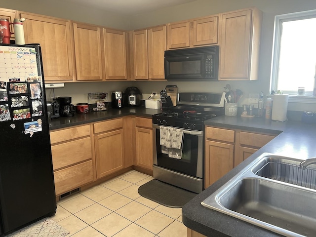 14703 Paul Revere Ct, Plainfield, IL 60544 - kitchen featuring black appliances, light tile patterned floors, dark countertops, and light brown cabinets
