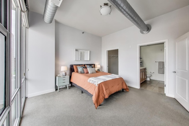 901 W Madison St Unit 609, Chicago, IL 60607 - bedroom featuring light carpet, a walk in closet, and ensuite bathroom