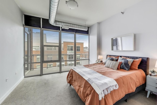 901 W Madison St Unit 609, Chicago, IL 60607 - carpeted bedroom featuring access to outside and expansive windows