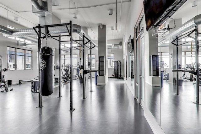 901 W Madison St Unit 609, Chicago, IL 60607 - gym with baseboards and a towering ceiling