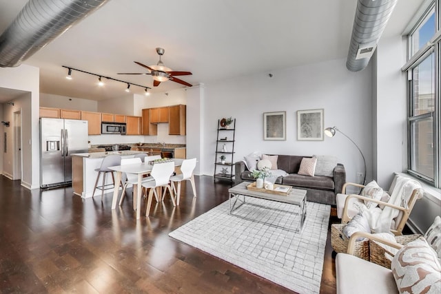 901 W Madison St Unit 609, Chicago, IL 60607 - living area featuring rail lighting, ceiling fan, and dark wood finished floors