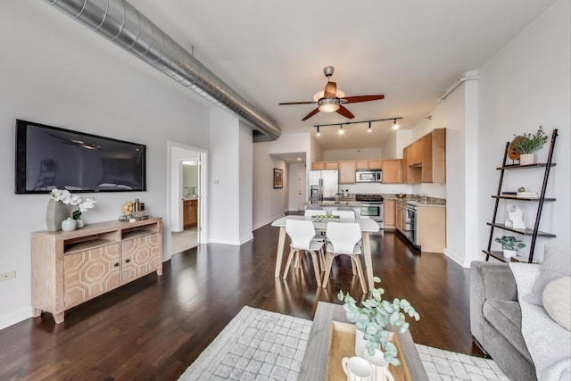 901 W Madison St Unit 609, Chicago, IL 60607 - living area featuring ceiling fan, dark wood-style flooring, and rail lighting