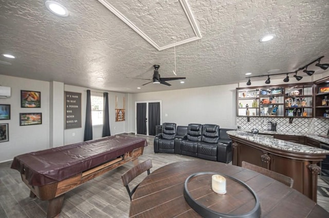 game room featuring a wall unit AC, recessed lighting, wood finished floors, and pool table