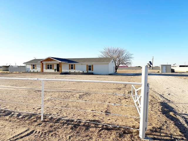 single story home featuring fence