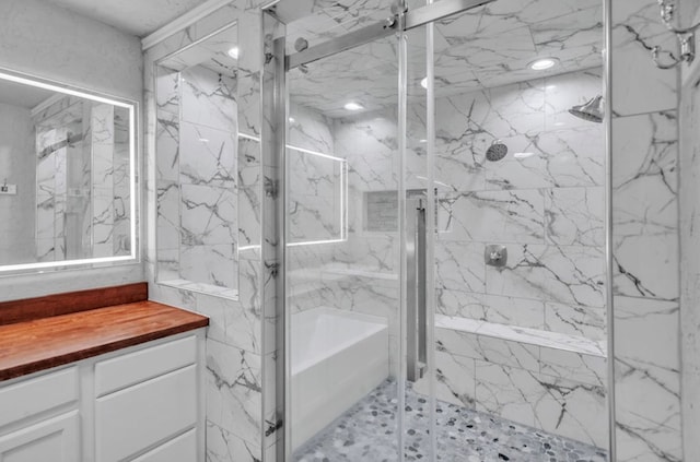 full bathroom with a marble finish shower and vanity