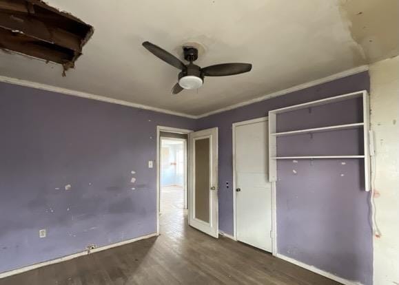 3105 Travis Ave, Midland, TX 79701 - unfurnished bedroom featuring wood finished floors, baseboards, a closet, and a ceiling fan