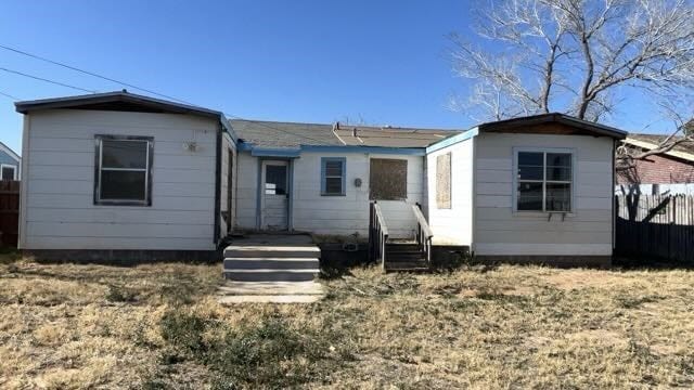 back of property with fence