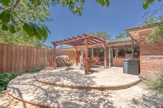 view of patio with fence and a pergola