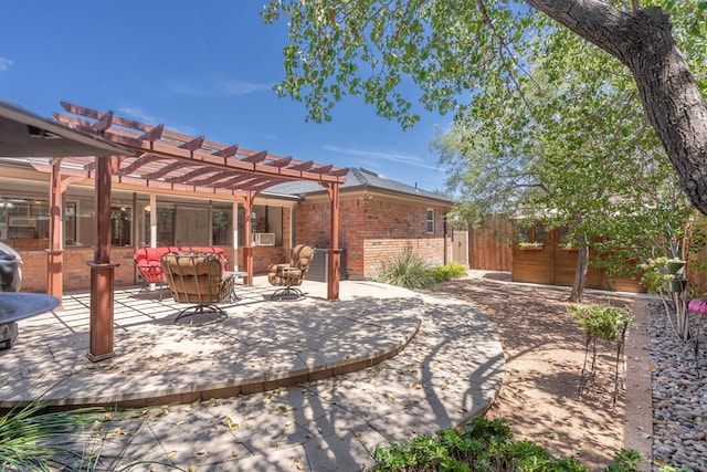 view of patio featuring fence, an outdoor hangout area, and a pergola