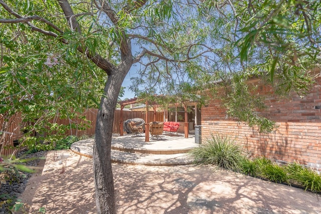 view of yard featuring a patio and fence