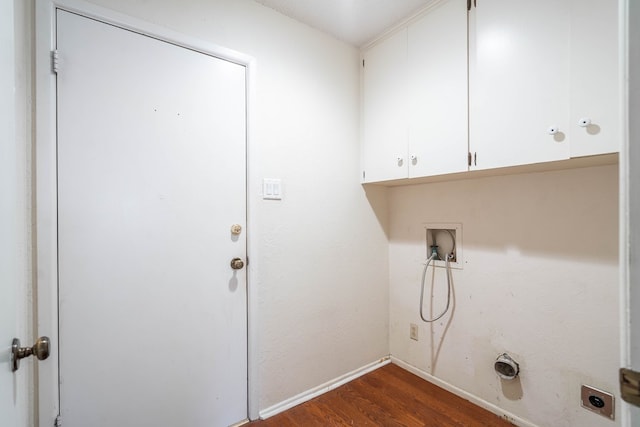 laundry room featuring dark wood-style flooring, hookup for a washing machine, cabinet space, hookup for an electric dryer, and baseboards