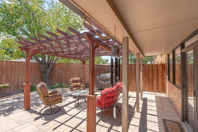 view of patio / terrace featuring fence and a pergola