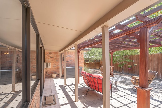 view of patio with a fenced backyard, an outdoor living space, and a pergola