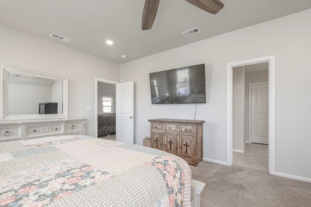 bedroom with baseboards, a ceiling fan, visible vents, and light colored carpet