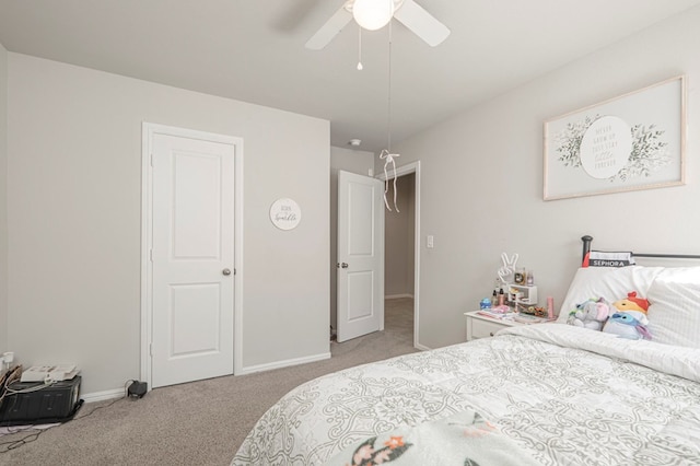 bedroom with light carpet, a ceiling fan, and baseboards