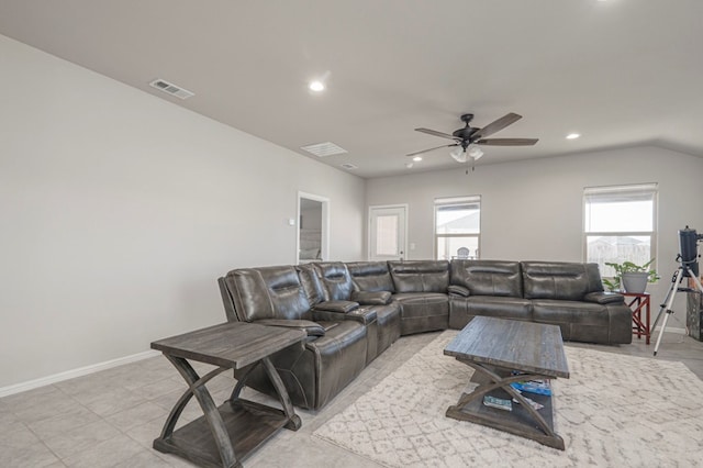 living area featuring recessed lighting, visible vents, and baseboards