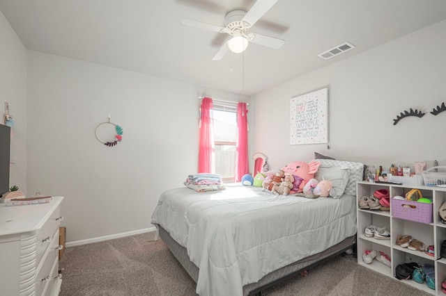 carpeted bedroom featuring a ceiling fan, visible vents, and baseboards