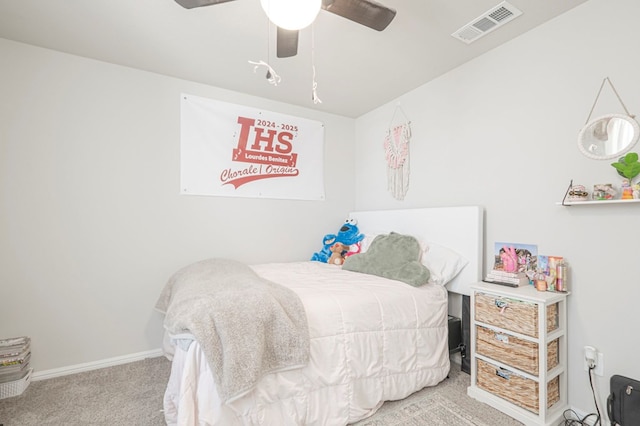 bedroom featuring a ceiling fan, light colored carpet, visible vents, and baseboards