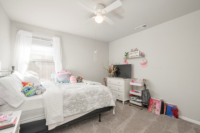 carpeted bedroom with ceiling fan and visible vents