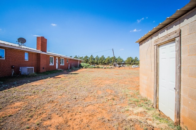 view of yard with central AC