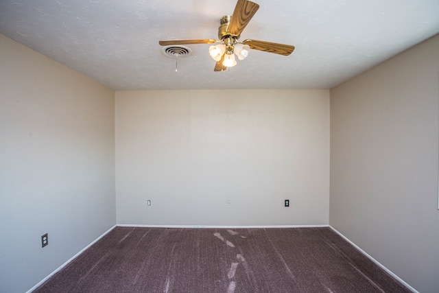 empty room featuring carpet, a textured ceiling, and ceiling fan