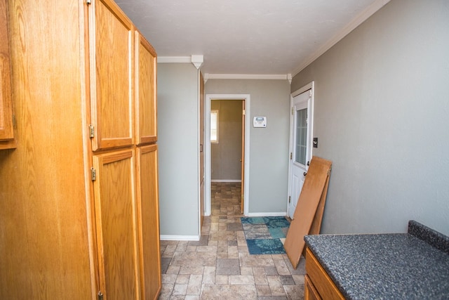 hallway featuring ornamental molding