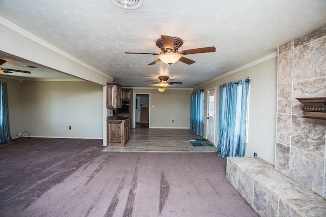 unfurnished living room featuring a textured ceiling, crown molding, and dark wood-type flooring