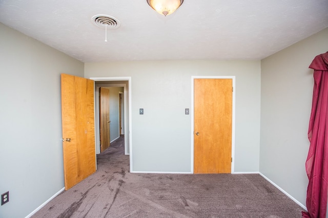 unfurnished bedroom with carpet flooring