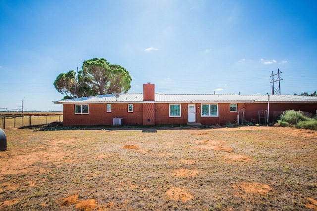 back of property featuring cooling unit