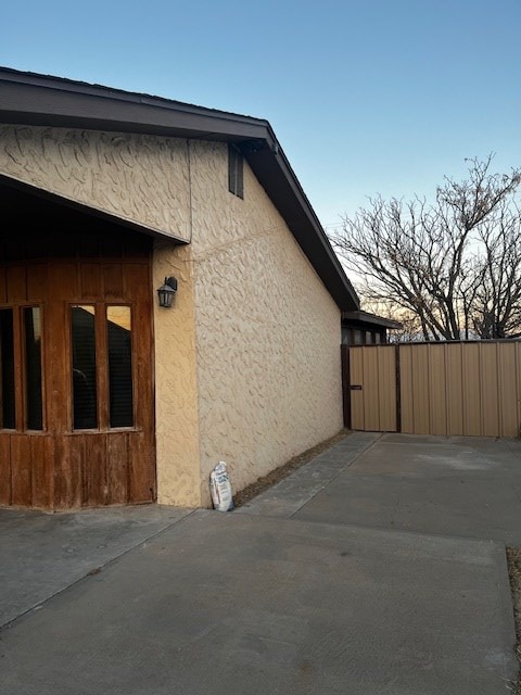 view of home's exterior featuring a patio area and stucco siding