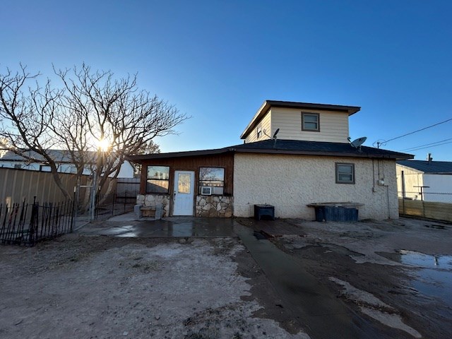 rear view of property with a patio and a fenced backyard