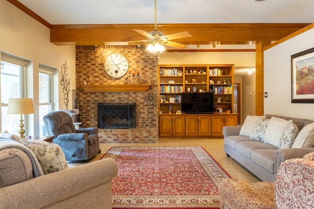 living area with light tile patterned floors, ornamental molding, a fireplace, and ceiling fan
