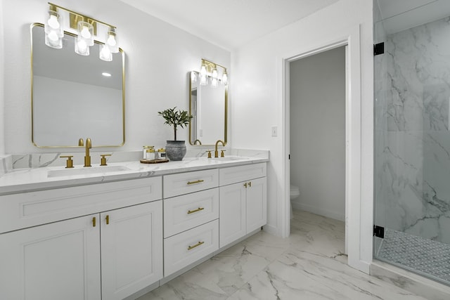 bathroom featuring vanity, a shower with shower door, and toilet