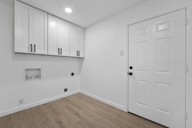 laundry area with washer hookup, light wood-type flooring, cabinets, and hookup for an electric dryer