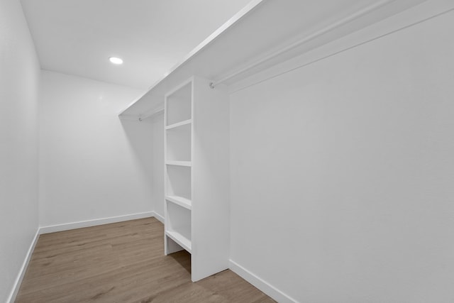 spacious closet featuring light hardwood / wood-style floors