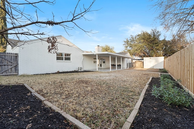 back of property featuring a patio area