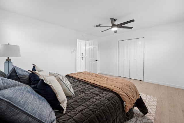 bedroom with ceiling fan, a closet, and light wood-type flooring