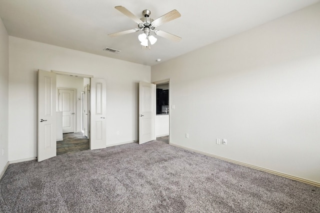 unfurnished bedroom with carpet flooring, baseboards, and ceiling fan