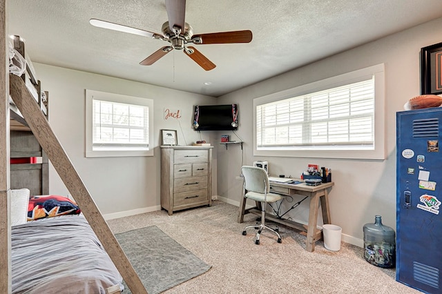 2804 W Dengar Ave, Midland, TX 79705 - carpeted office featuring plenty of natural light, ceiling fan, baseboards, and a textured ceiling