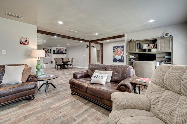 2804 W Dengar Ave, Midland, TX 79705 - living room featuring light wood-style flooring, recessed lighting, beam ceiling, and baseboards