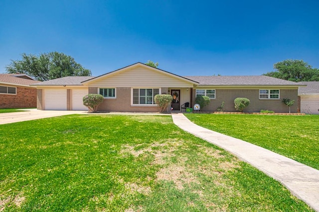2804 W Dengar Ave, Midland, TX 79705 - single story home with driveway, an attached garage, a front lawn, and brick siding