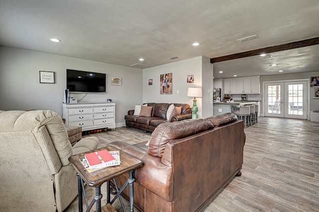 2804 W Dengar Ave, Midland, TX 79705 - living area featuring light wood-style flooring, recessed lighting, and french doors