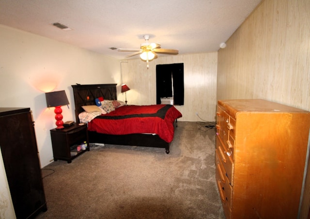 carpeted bedroom with visible vents and ceiling fan