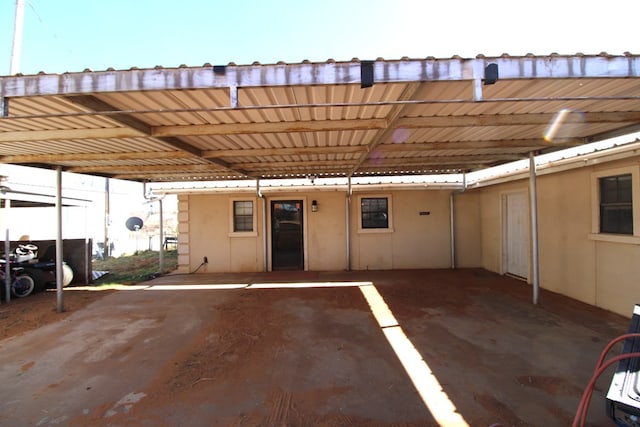 exterior space featuring covered parking