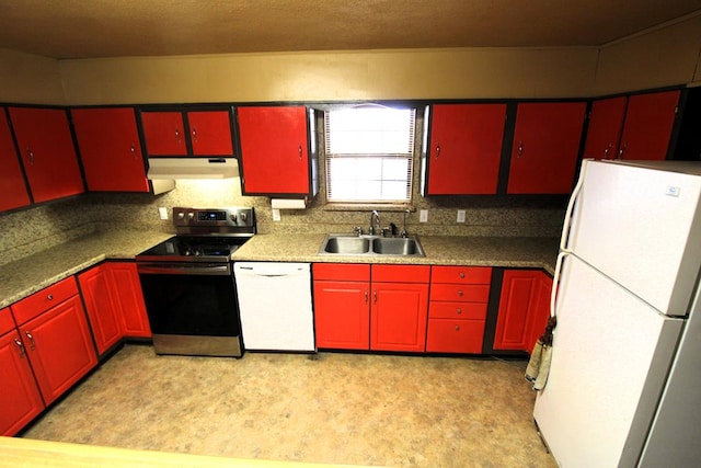 kitchen featuring red cabinets, white appliances, light floors, under cabinet range hood, and a sink