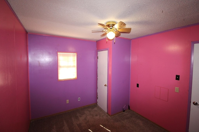 unfurnished bedroom with a textured ceiling, a ceiling fan, and carpet floors