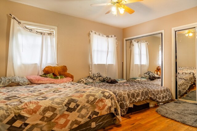 bedroom with hardwood / wood-style flooring and ceiling fan