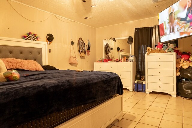 bedroom with light tile patterned flooring